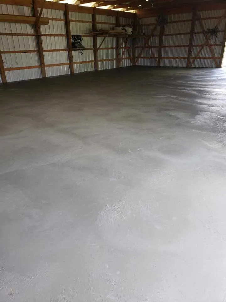 freshly troweled concrete slab inside an open barn in Royal Palm Beach