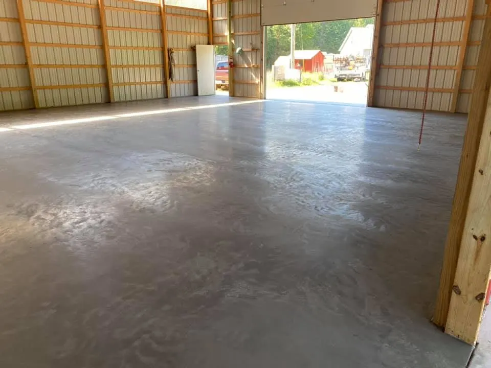 smooth concrete floor slab inside a framed pole barn in Royal Palm Beach